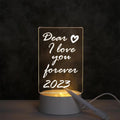 LED Acrylic Message Board Night Lamp glowing with handwritten message in a cozy room