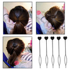 Pair of black heart-shaped hairpins placed side by side