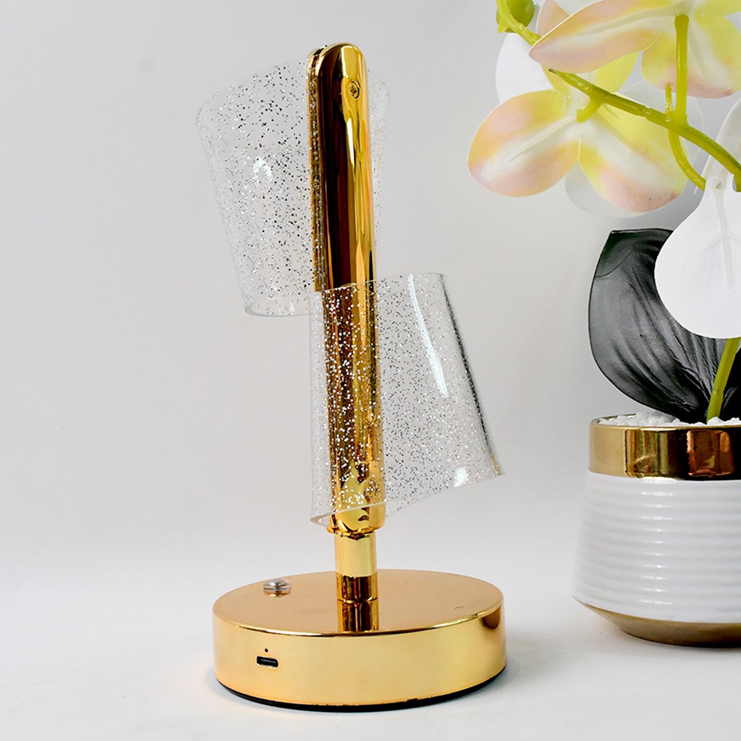 Golden base crystal LED double shade table lamp illuminating cozy room