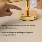 Golden base table lamp with crystal-effect double shades creating ambient light