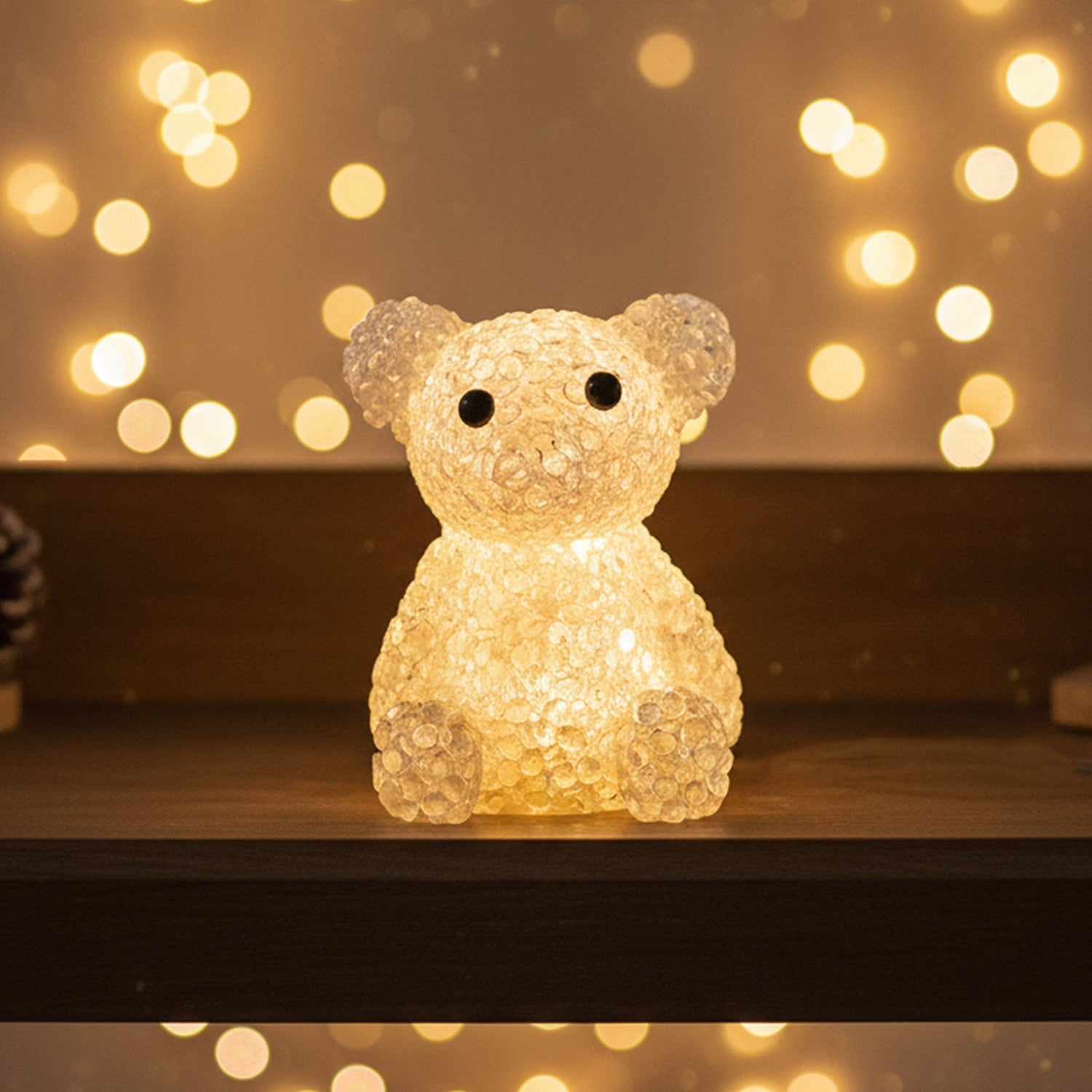 Color-changing bear LED night lamp placed on a wooden tabletop