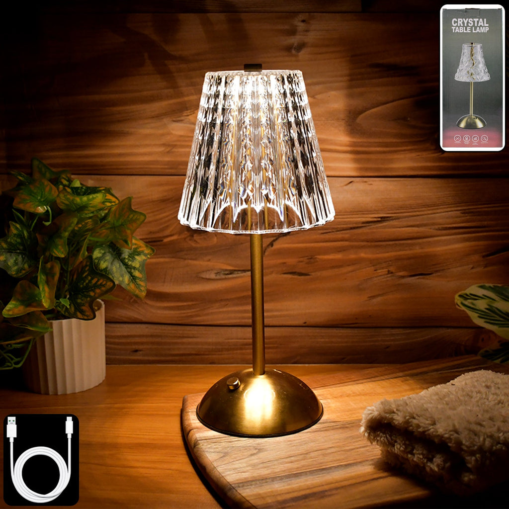 Crystal table lamp with elegant crystal shade on metallic base