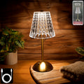 Crystal table lamp with elegant crystal shade on metallic base