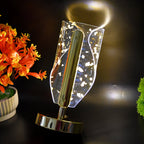 Modern crystal table lamp with golden leaf detailing and metal base