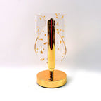 Energy-efficient LED table lamp with crystal-cut shade and golden leaf accents