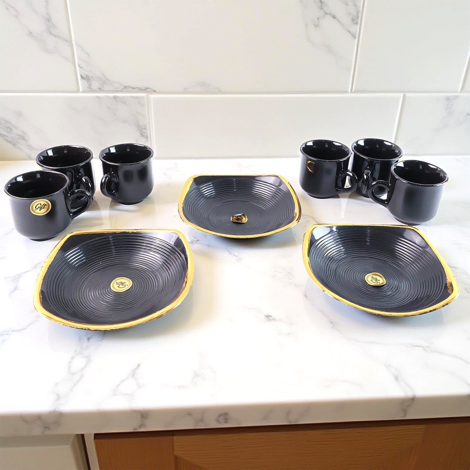 Elegant seashell ceramic cup set with matching plastic bowls arranged for serving.