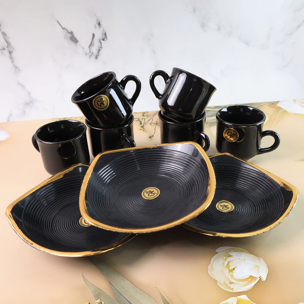 Overhead view of the complete seashell ceramic cup and bowl set.