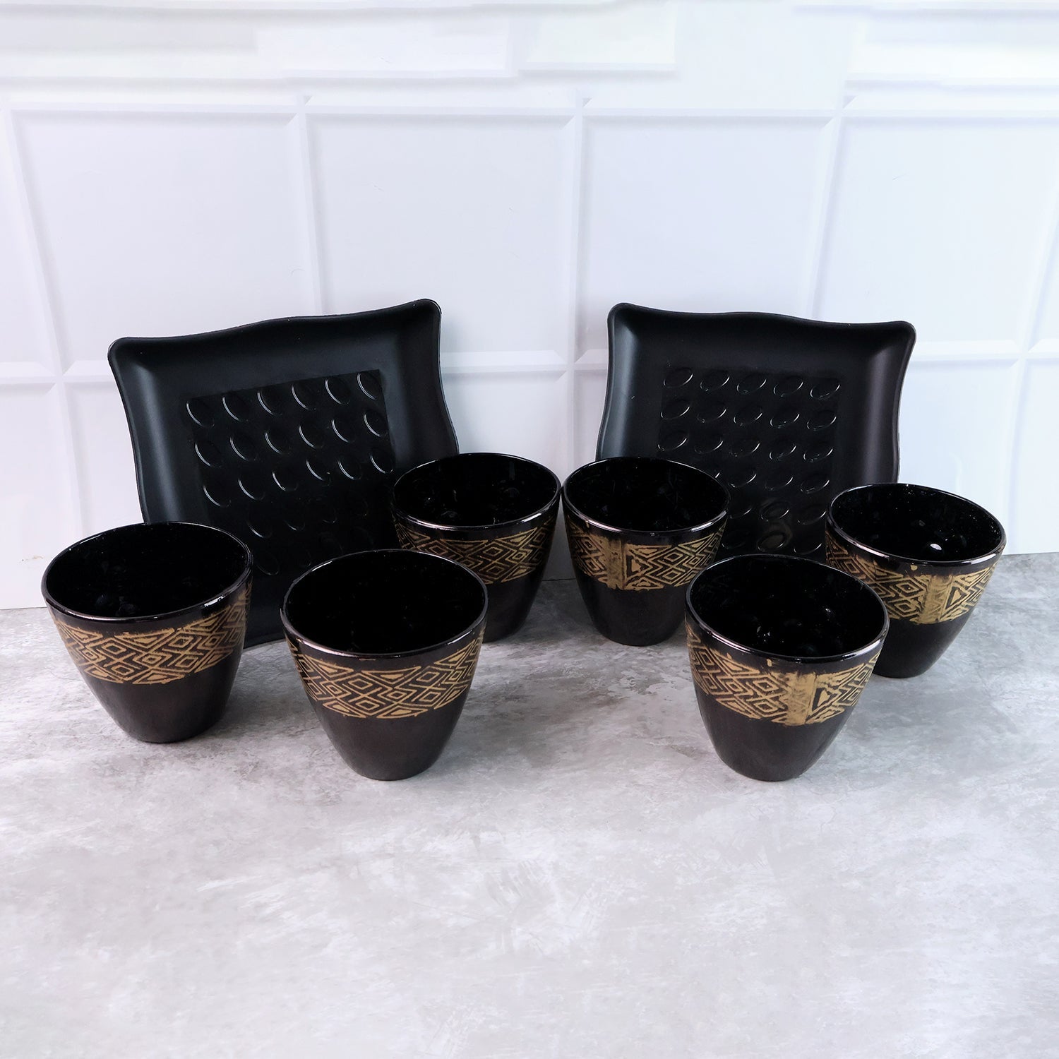 Complete 8-piece ceramic bowl and cup set elegantly displayed for dining.