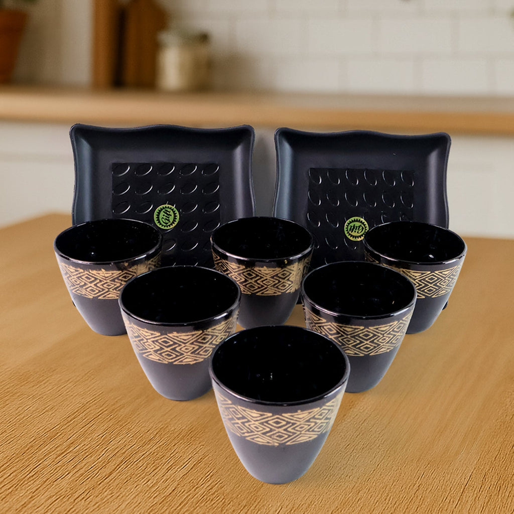Close-up of the ceramic cups and bowls, highlighting the intricate design details.