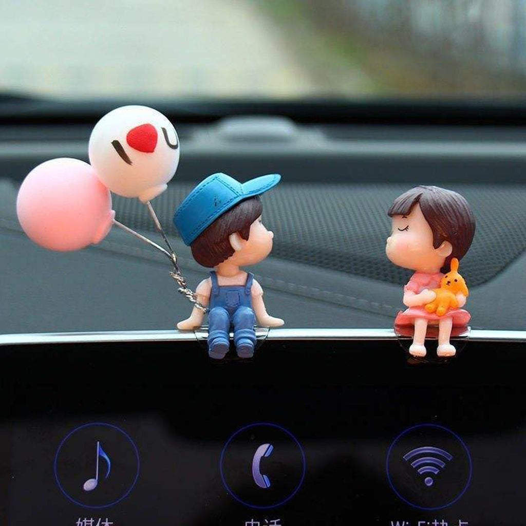 Dashboard couple showpiece with attractive detailing