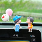 Small decorative figurine for car dashboard or table