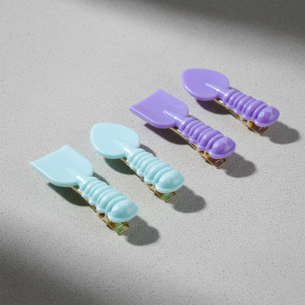 Lifestyle image showing girls wearing spoon shaped hair clips