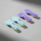 Lifestyle image showing girls wearing spoon shaped hair clips