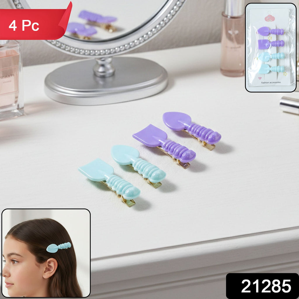 Close-up of colorful spoon and spatula hair clips securely holding hair