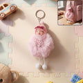 Plush doll keychain with cute sleeping face and soft fur ball attached on metal ring