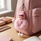 Plush doll keychain hanging securely on durable metal key ring