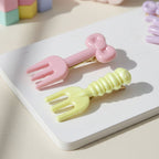 Close-up view of mini fork-shaped pastel hair clips