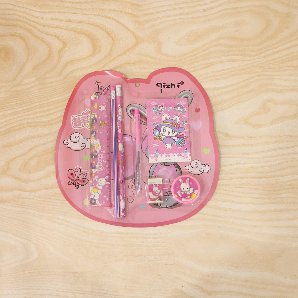 Pink kids stationery set displayed with all included items