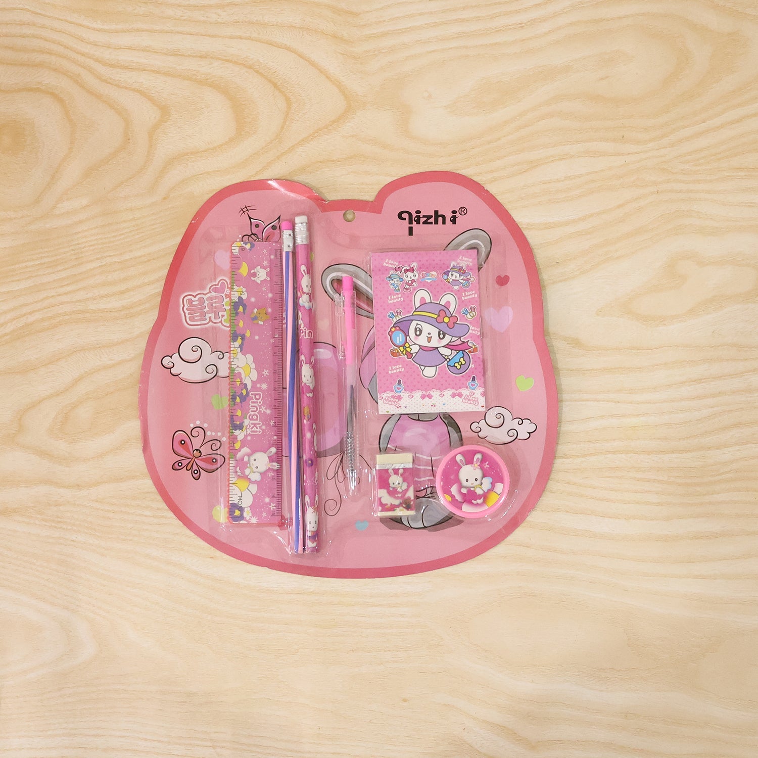 Pink kids stationery set displayed with all included items