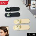 Close-up of snap hair clips featuring playful cartoon characters