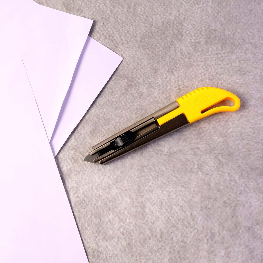 Angled view of heavy-duty utility cutter knife
