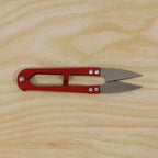 Thread cutter snip scissors angled view showing sharp blades