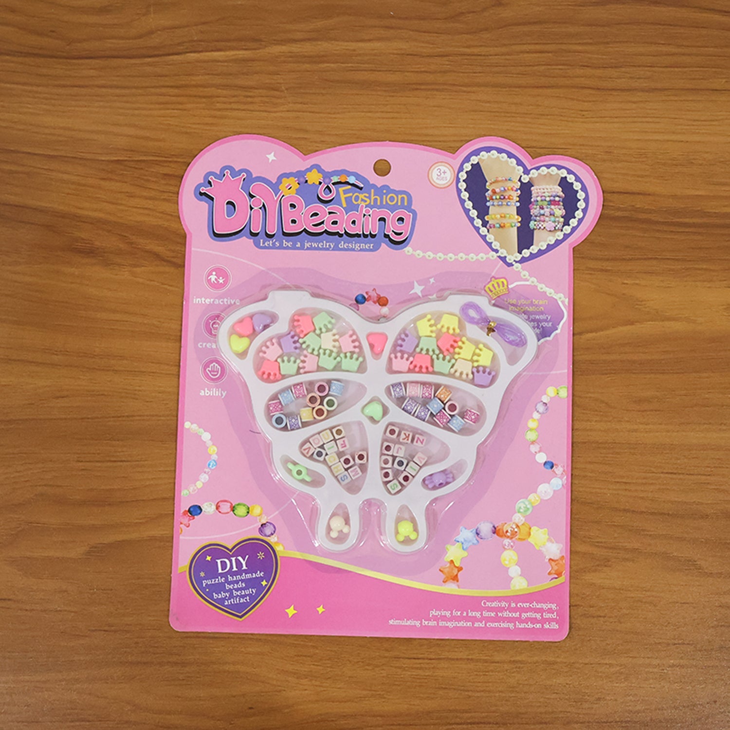 Creative kids using jewellery making kit to craft bracelets and necklaces