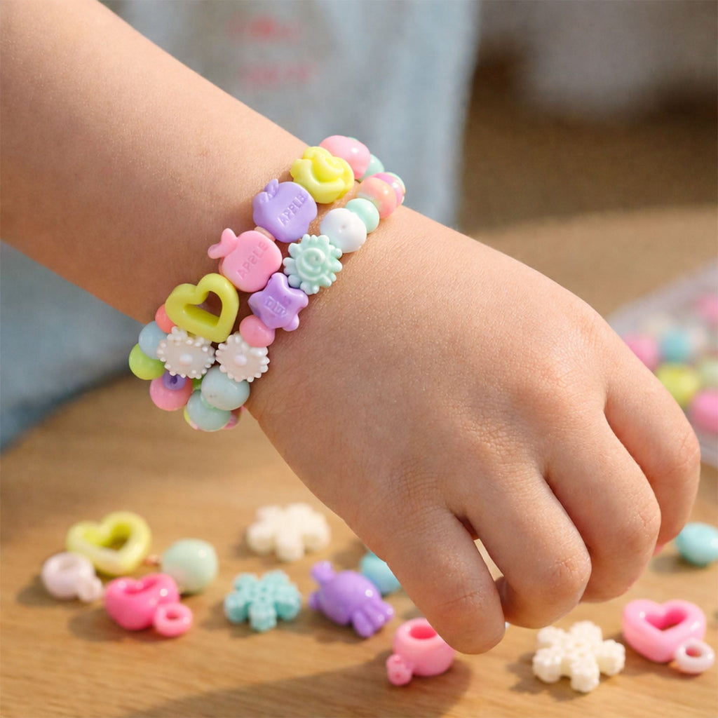 Elastic thread and heart charms included in the jewellery making kit for kids