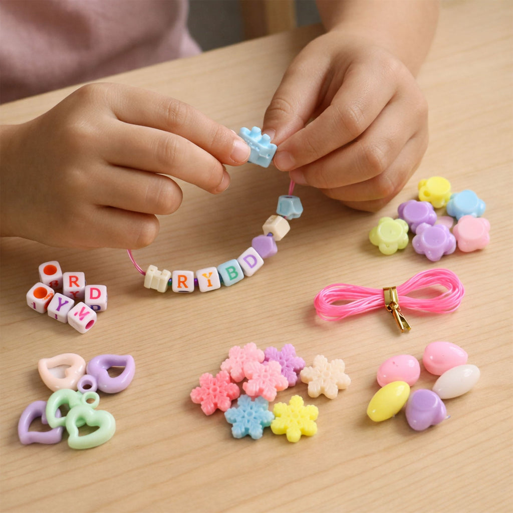 DIY kids jewellery crafting kit in use with finished bracelets