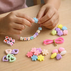 DIY kids jewellery crafting kit in use with finished bracelets