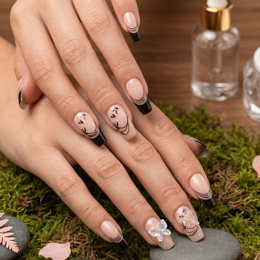 Full view of burgundy artificial press-on nails featuring mixed floral art design
