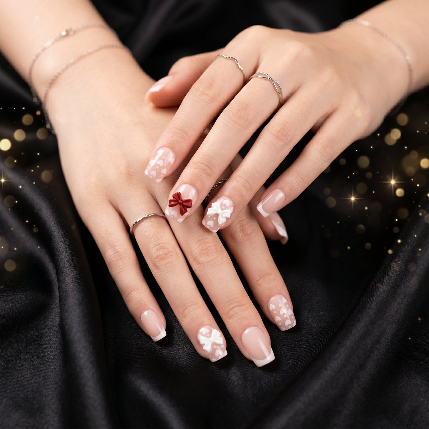 Close-up of glitter 3D floral press-on nails highlighting intricate petal and crystal embellishments.