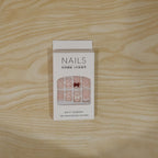 Model’s hand adorned with glamorous glitter 3D floral press-on nail tips for special events.