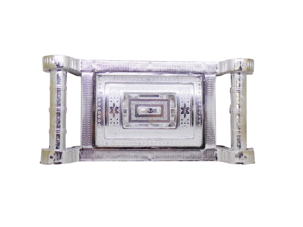 Close-up of a silver gift box with royal design, ideal for special occasions.