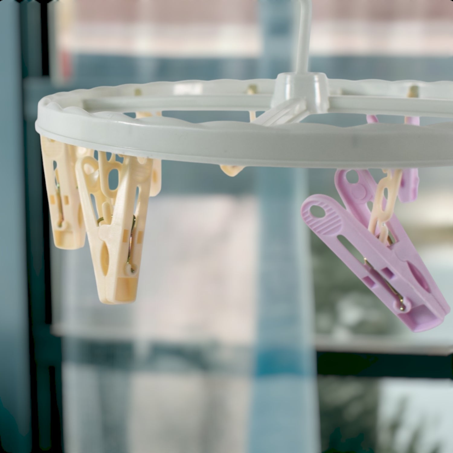 Close up of metal clips on clothespin drying rack with strong grip