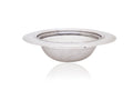 Stainless steel sink strainer effectively catching food particles in a kitchen wash basin drain.