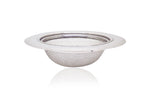 Stainless steel sink strainer effectively catching food particles in a kitchen wash basin drain.