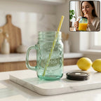Clear glass Mason Jar with Handle and reusable BPA-free straw.