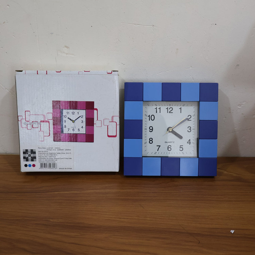 Stylish square table clock enhancing a modern room's decor.