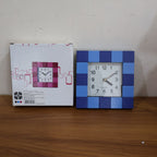 Stylish square table clock enhancing a modern room's decor.