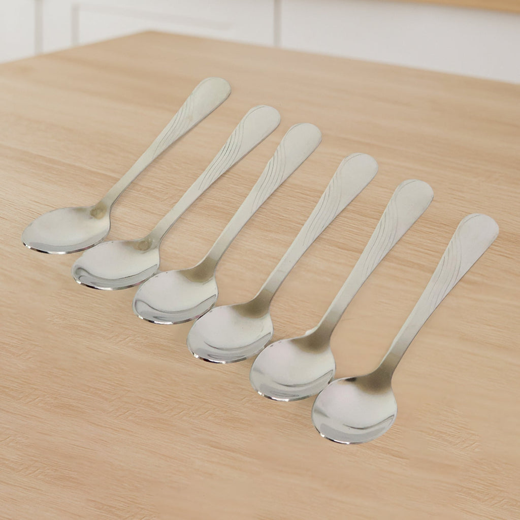 Close-up view of stainless steel dining spoons highlighting their sleek design