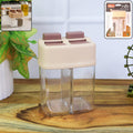 Dual chamber salt and pepper dispenser with transparent body and flip lids