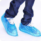 Disposable shoe covers in use on shoes