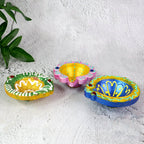 Assorted hand-painted clay diya set showcasing vibrant colors and artistic finish