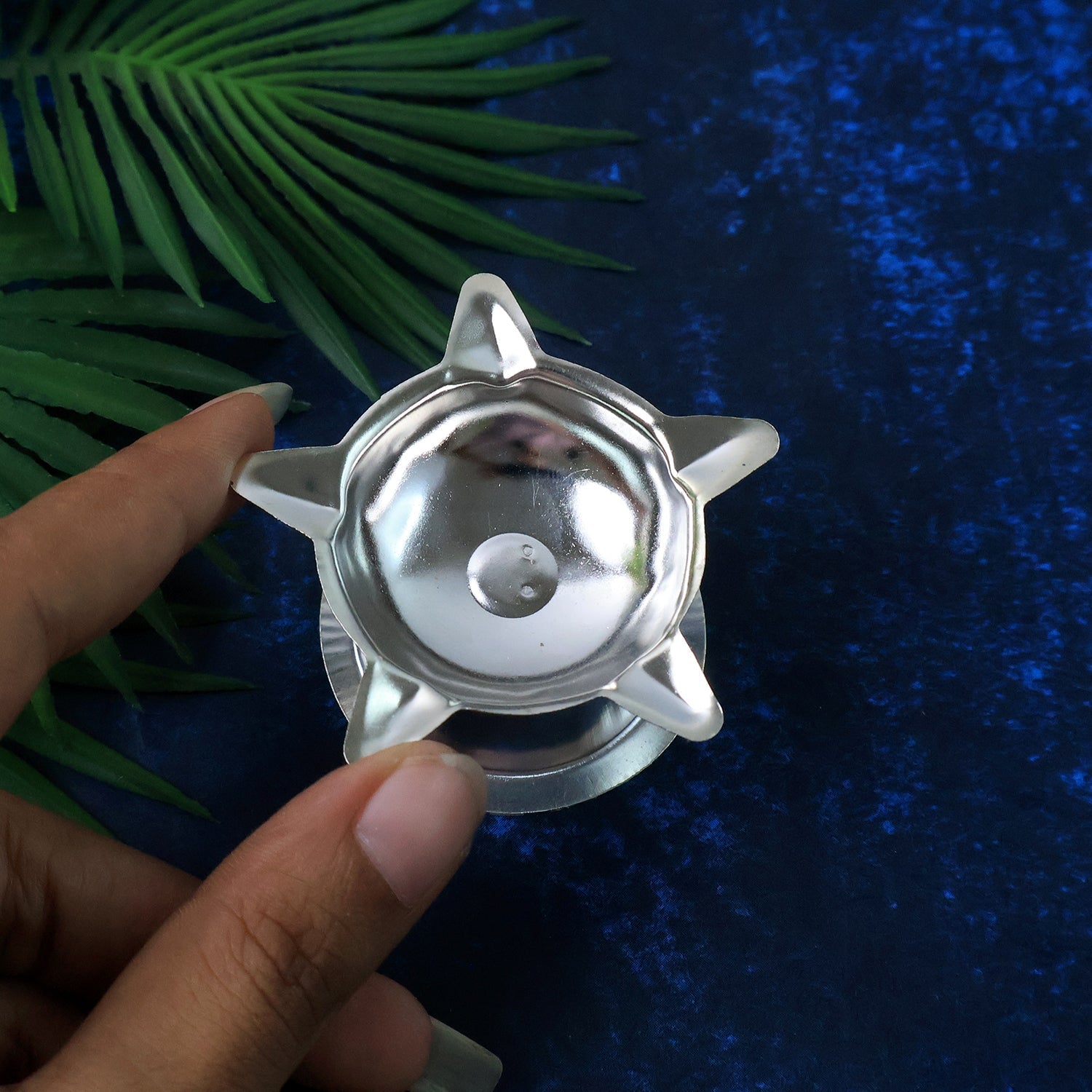 Video showcasing lotus design stainless steel diya for home puja setup