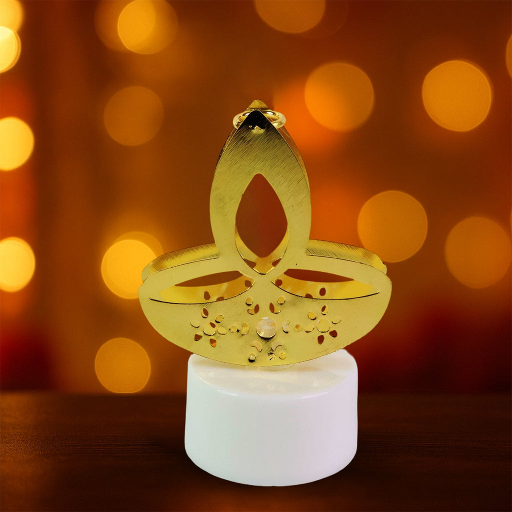 Golden LED diya candles with elegant metal finish topper on table