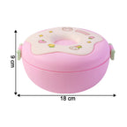 A single Donut Lunch Box and its matching spoon on a clean surface.