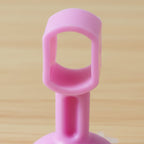 Soft silicone door stopper with suction base on wall