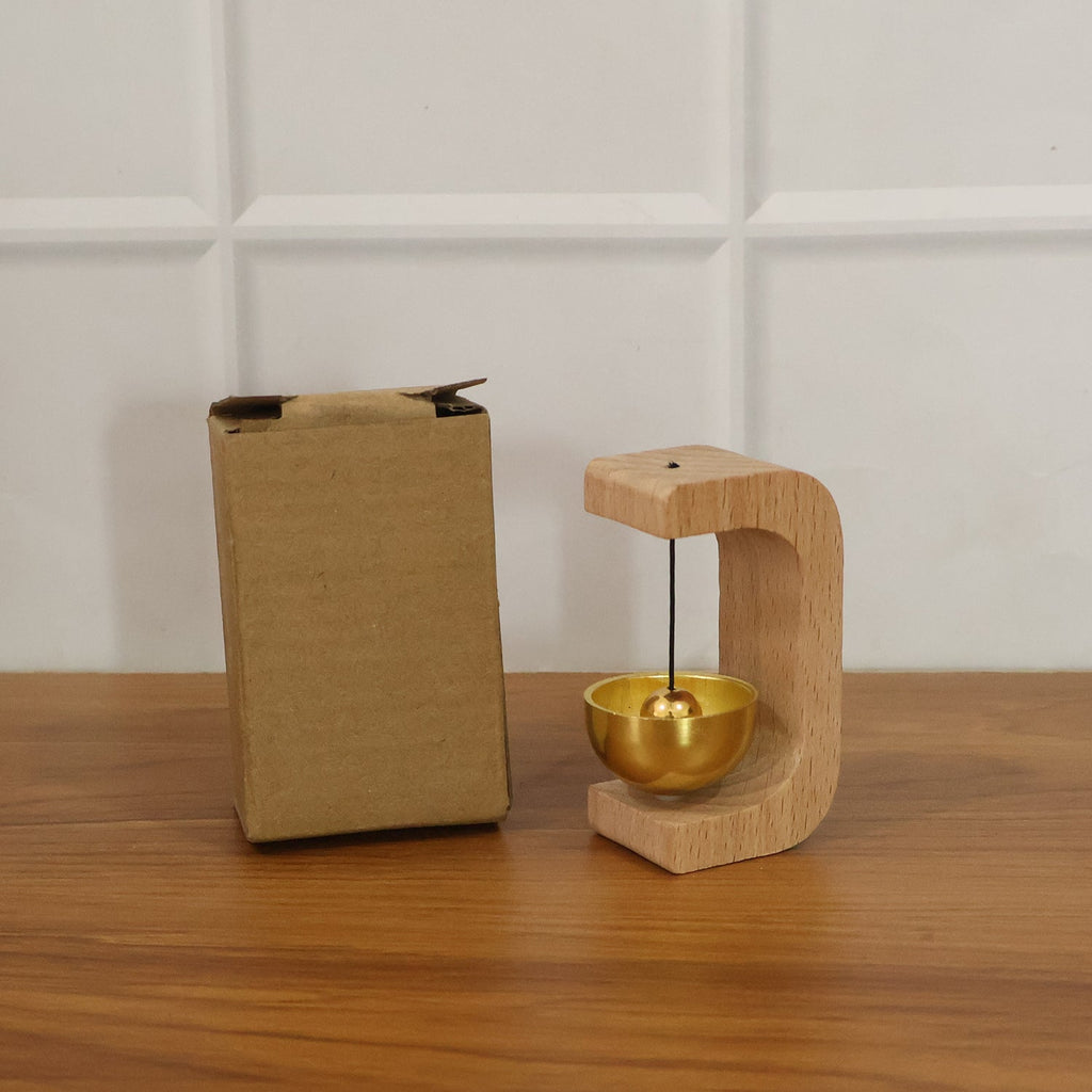 Zen meditation bell positioned on stand bathed in natural light