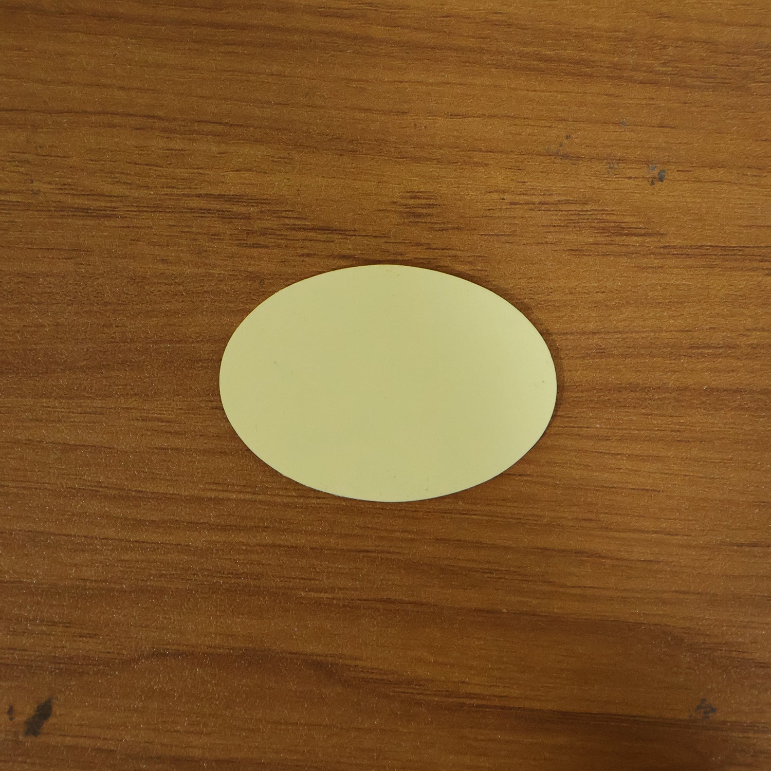 Round self-adhesive anti-slip furniture pad on surface